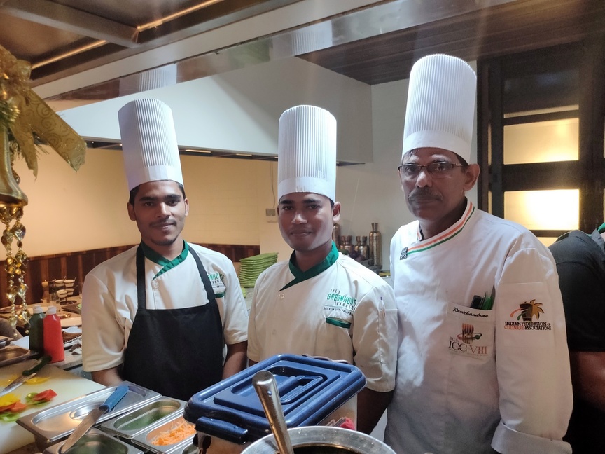 Chef AVR with professional culinary team in kitchen